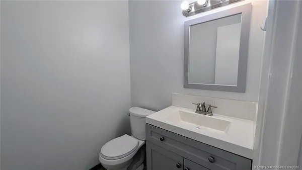 a kitchen with granite countertop a sink and a window