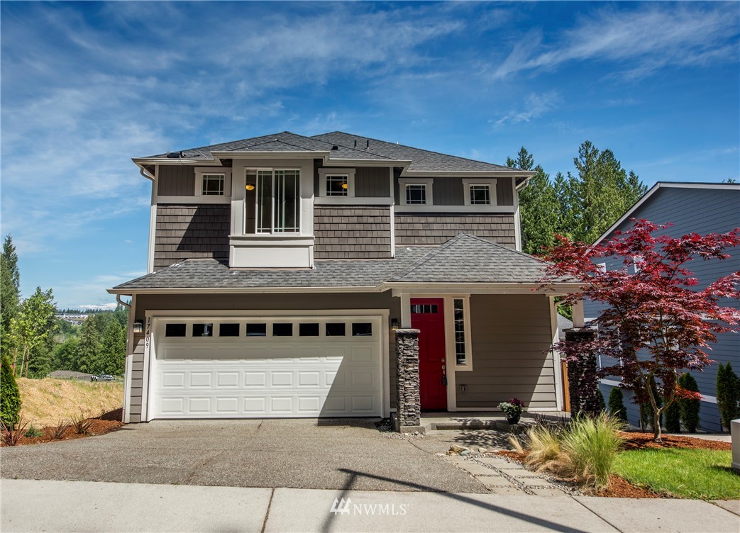 17409 3rd Avenue Southeast Bothell, WA 98012 - Photo 2 of 26 a front view of a house with a yard
