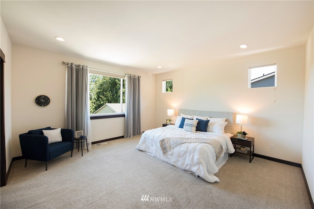 17409 3rd Avenue Southeast Bothell, WA 98012 - Photo 11 of 26 a bedroom with a bed and a couch
