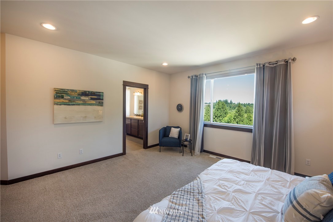 17409 3rd Avenue Southeast Bothell, WA 98012 - Photo 12 of 26 a bedroom with a bed and a large window