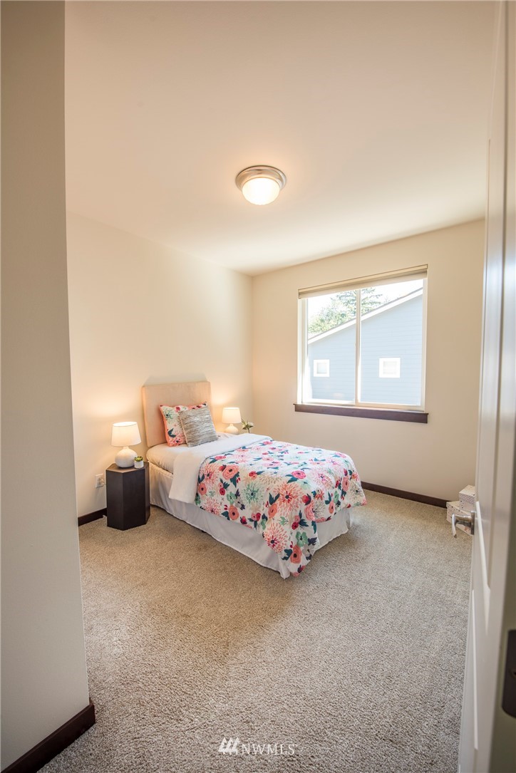 17409 3rd Avenue Southeast Bothell, WA 98012 - Photo 17 of 26 a bedroom with a bed and window