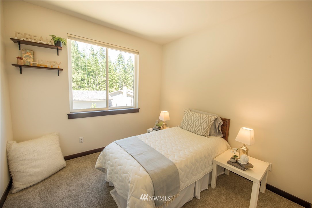 17409 3rd Avenue Southeast Bothell, WA 98012 - Photo 18 of 26 a bedroom with a bed and a window