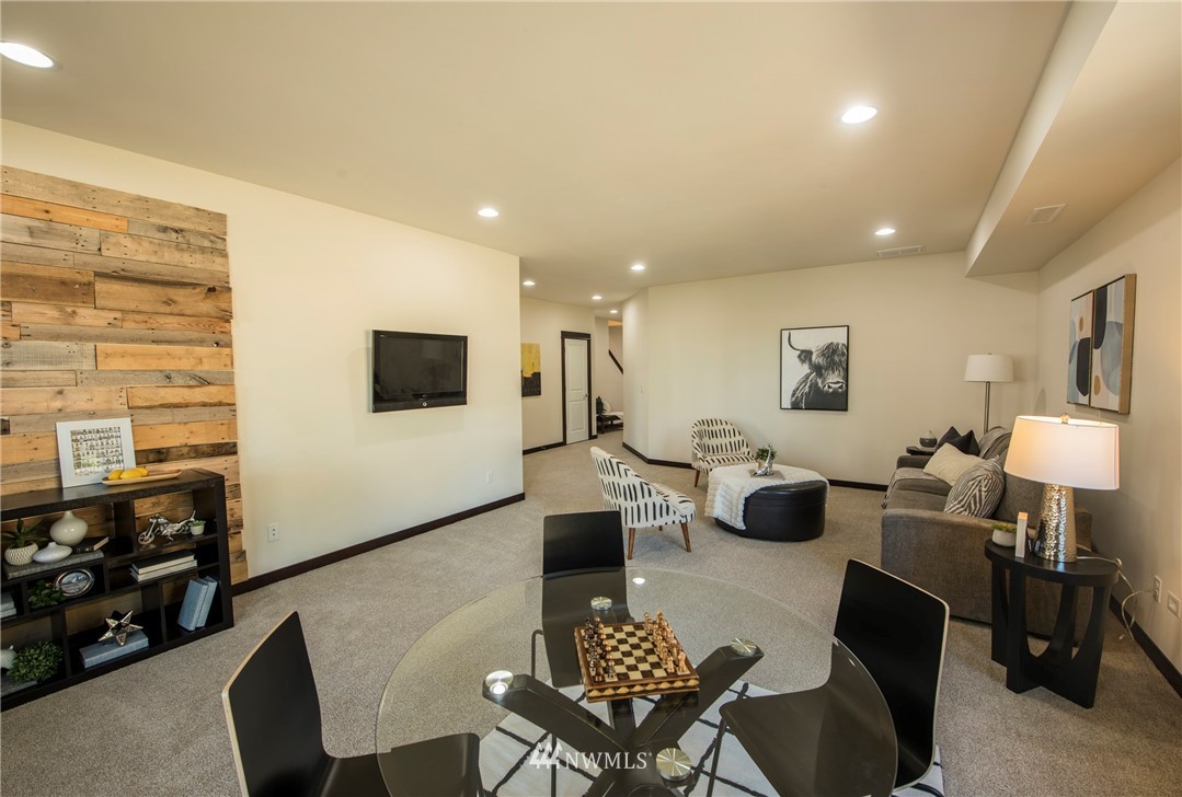 17409 3rd Avenue Southeast Bothell, WA 98012 - Photo 20 of 26 a living room with furniture a flat screen tv and kitchen view