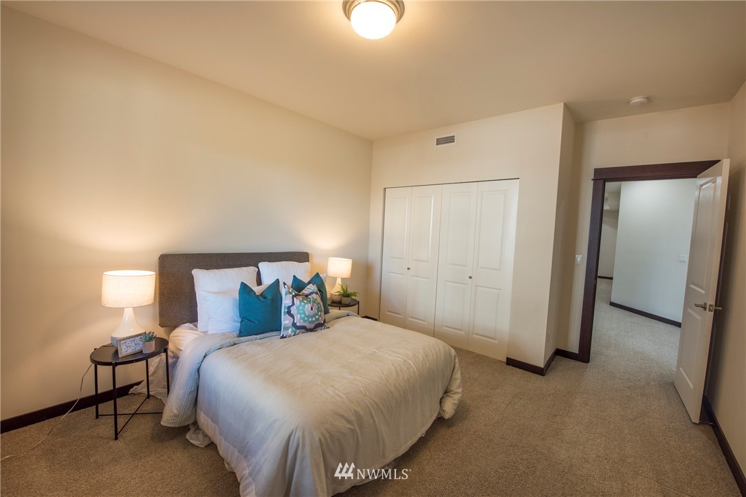 17409 3rd Avenue Southeast Bothell, WA 98012 - Photo 21 of 26 a bed room with a bed and a lamp