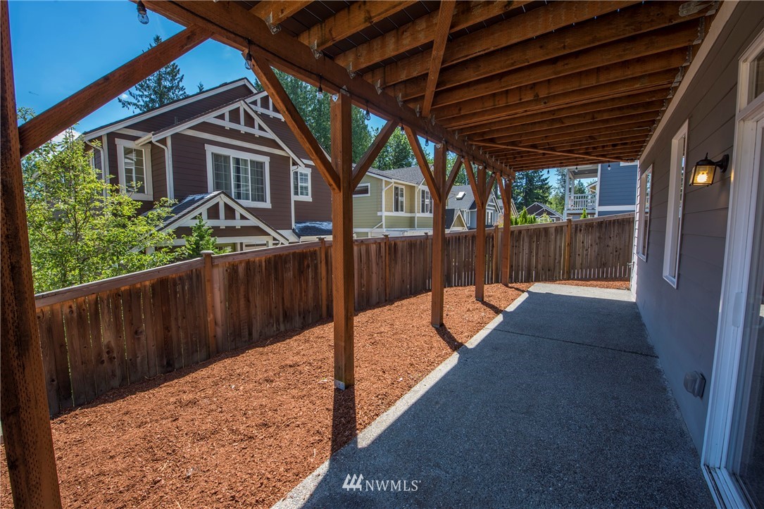17409 3rd Avenue Southeast Bothell, WA 98012 - Photo 24 of 26 a view of a house with a wooden fence