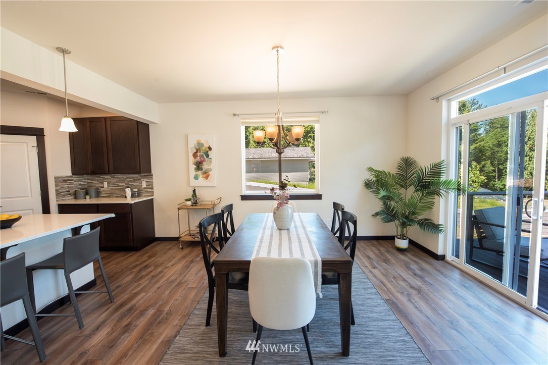 17409 3rd Avenue Southeast Bothell, WA 98012 - Photo 6 of 26 a view of a dining room with furniture window and wooden floor