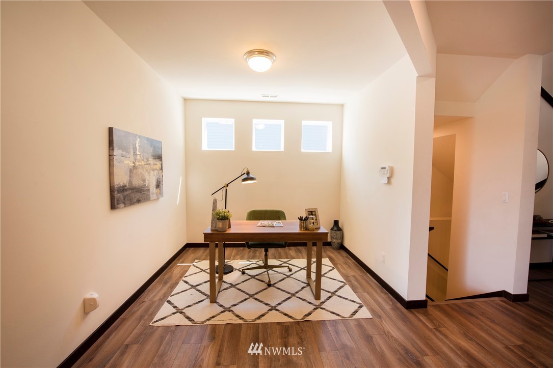 17409 3rd Avenue Southeast Bothell, WA 98012 - Photo 10 of 26 a view of a hallway with wooden floor and white walls