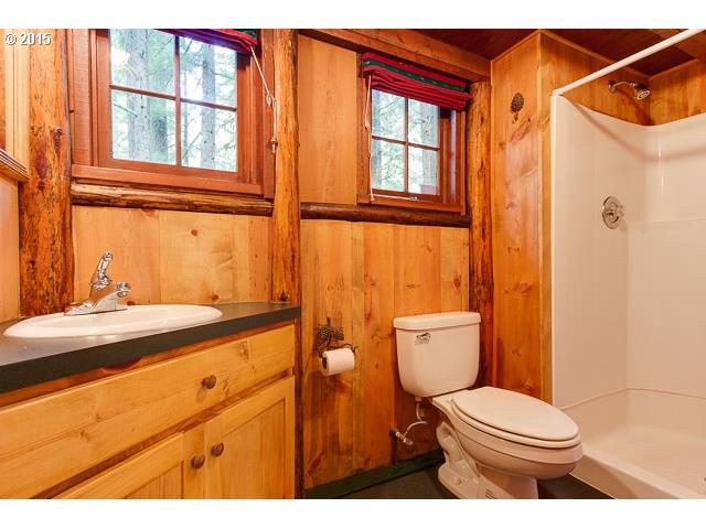 79546 Road 35 A, Unit 54 Rhododendron, OR 97049 - Photo 8 of 16 a bathroom with a granite countertop sink toilet and shower