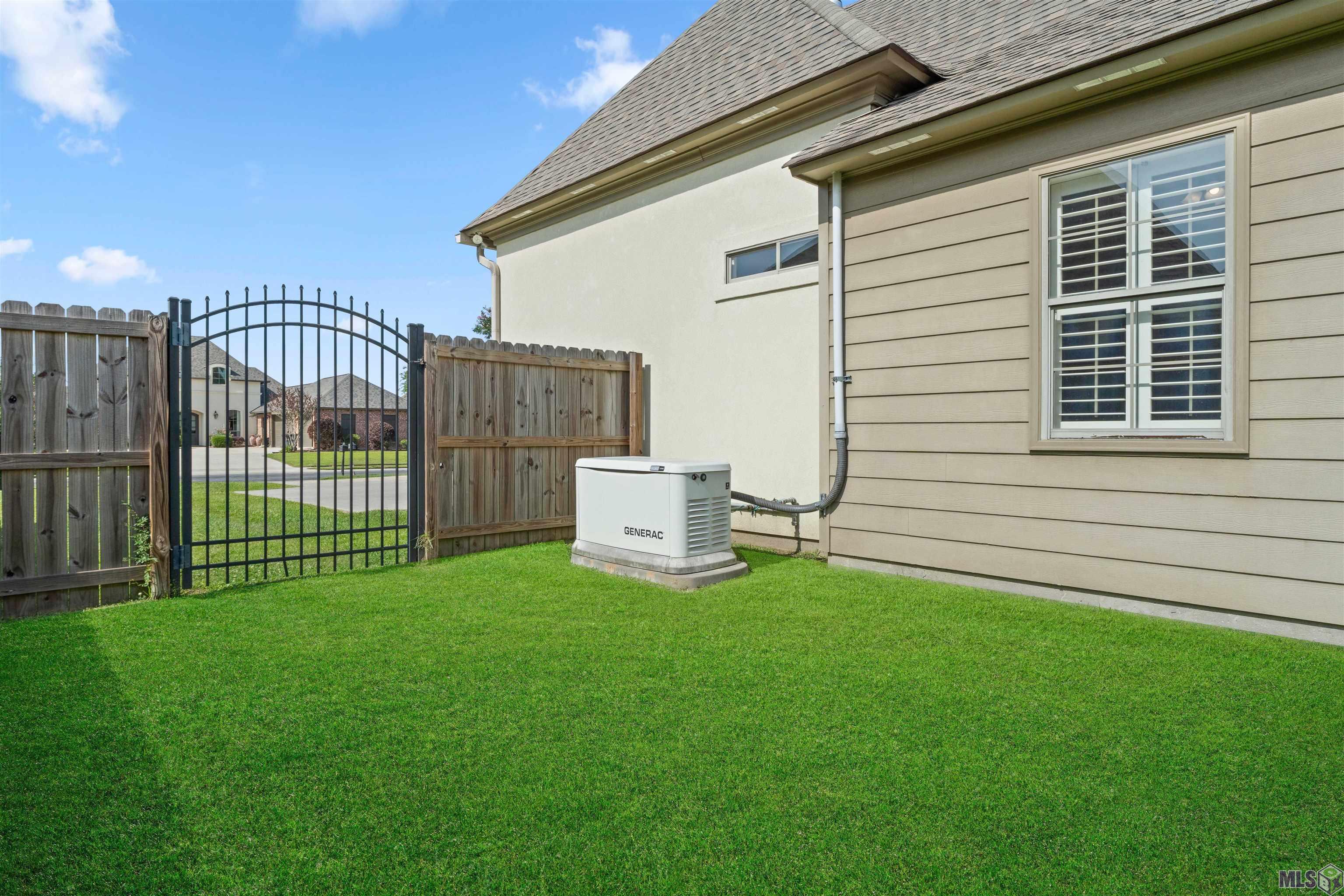 19212 Merlot Avenue St. George, LA 70817 - Photo 24 of 25 Generator and Wrought Iron gate