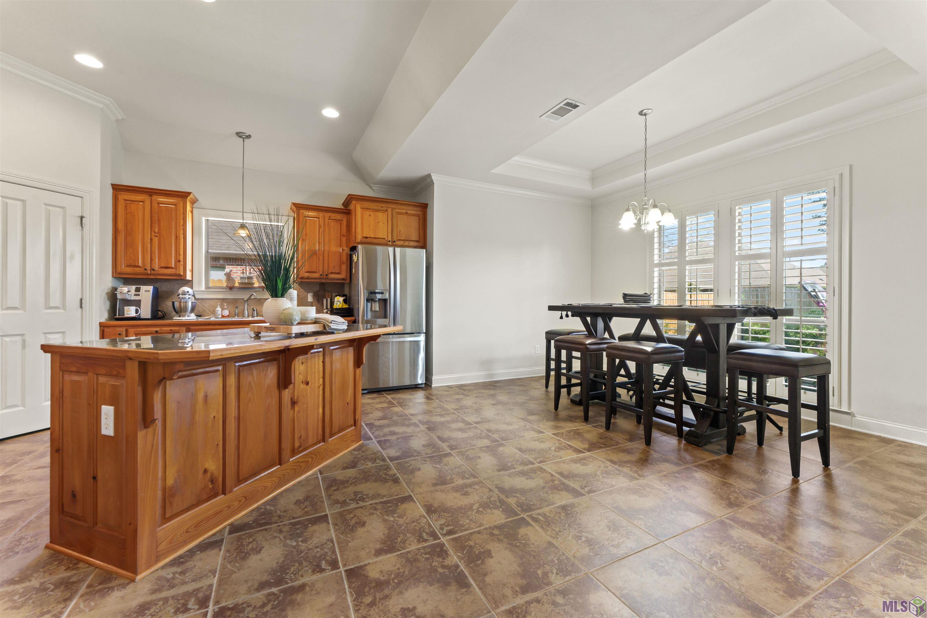 19212 Merlot Avenue St. George, LA 70817 - Photo 8 of 25 Breakfast Area and Kitchen