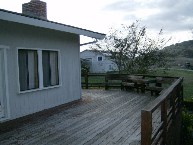 4061 Cienega Road Hollister, CA 95023 - Photo 14 of 25 a backyard of a house with wooden floor and outdoor seating
