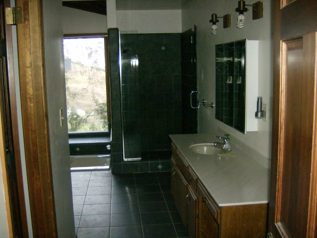 4061 Cienega Road Hollister, CA 95023 - Photo 16 of 25 a bathroom with a sink a toilet and shower