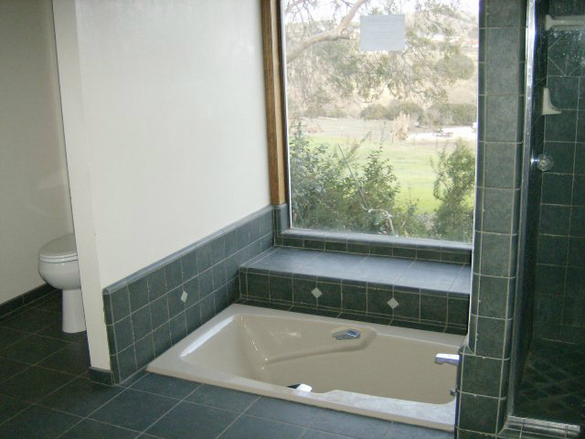 4061 Cienega Road Hollister, CA 95023 - Photo 17 of 25 a bathroom with a bathtub and toilet