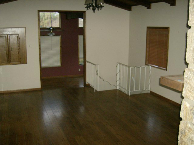 4061 Cienega Road Hollister, CA 95023 - Photo 10 of 25 a view of a livingroom with wooden floor and stairs