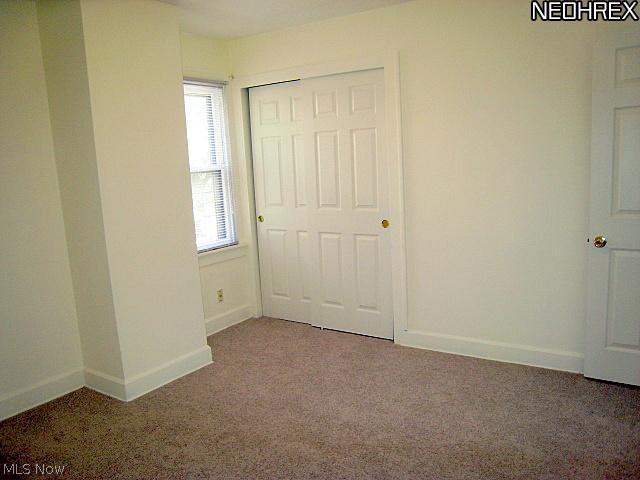1051 Roanoke Road Cleveland, OH 44121 - Photo 15 of 25 Master Bedroom w/New Carpet, Freshly Painted and Windows to let the sun shine in. Double Closet too.