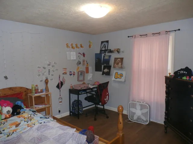 a view of a workspace with furniture and toys