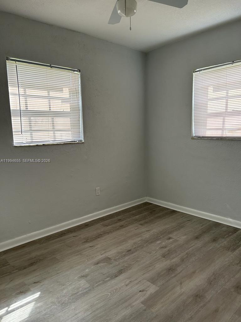 14735 Southwest 107th Avenue Miami, FL 33176 - Photo 6 of 9 an empty room with a window
