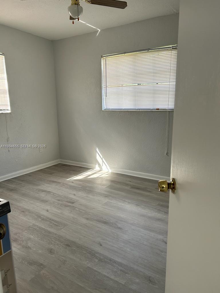 14735 Southwest 107th Avenue Miami, FL 33176 - Photo 7 of 9 wooden floor in a bathroom