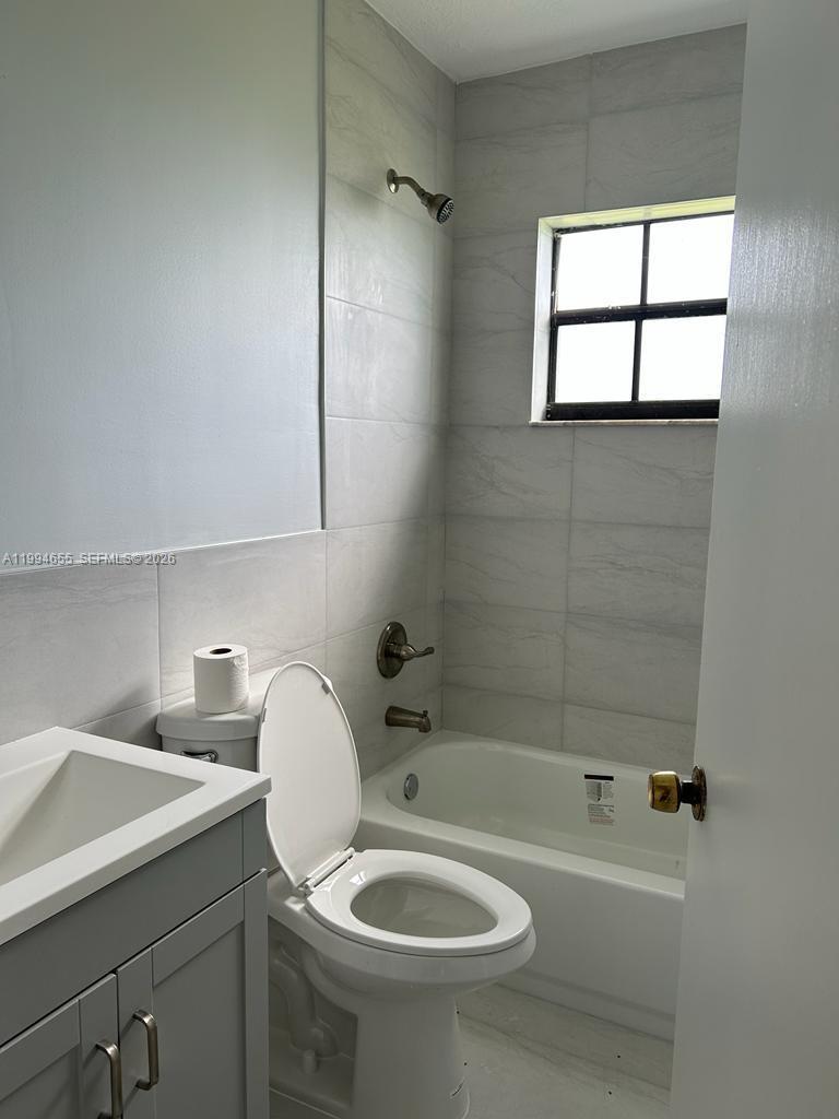 14735 Southwest 107th Avenue Miami, FL 33176 - Photo 8 of 9 a bathroom with a sink a toilet and shower