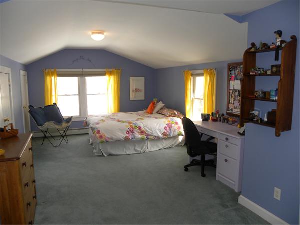82 Ortins Road Hamilton, MA 01982 - Photo 14 of 25 a bed room with a bed and a chair