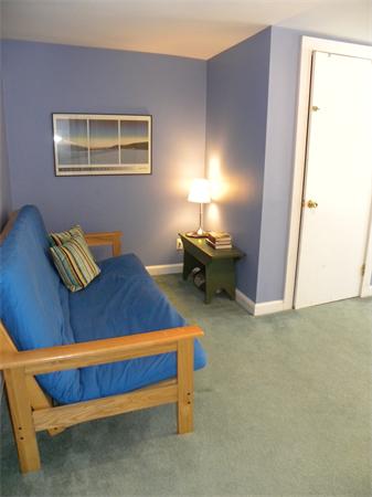 82 Ortins Road Hamilton, MA 01982 - Photo 15 of 25 a bed sitting in a bedroom next to a window