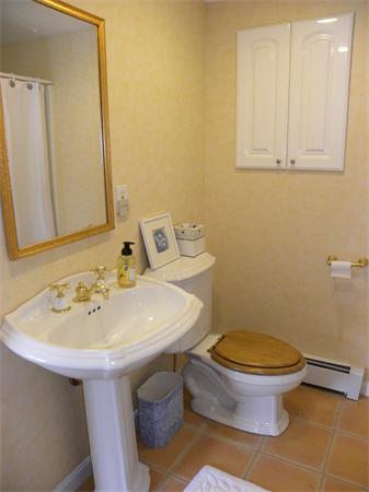 82 Ortins Road Hamilton, MA 01982 - Photo 20 of 25 a bathroom with a sink a toilet and mirror