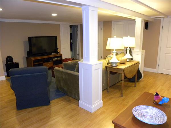82 Ortins Road Hamilton, MA 01982 - Photo 24 of 25 a living room with furniture and a flat screen tv