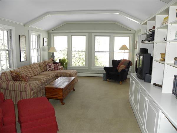 82 Ortins Road Hamilton, MA 01982 - Photo 4 of 25 a living room with furniture and a flat screen tv