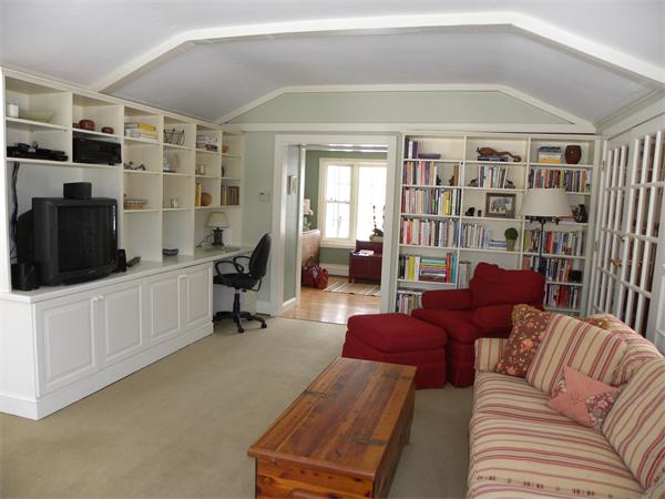 82 Ortins Road Hamilton, MA 01982 - Photo 5 of 25 a living room with furniture and a flat screen tv