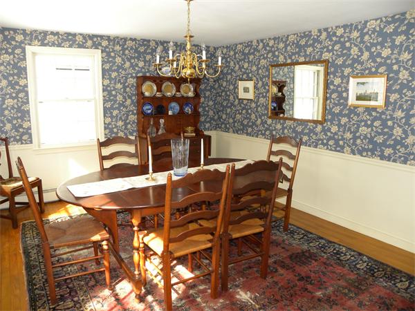 82 Ortins Road Hamilton, MA 01982 - Photo 8 of 25 a view of a dining room with furniture and chandelier