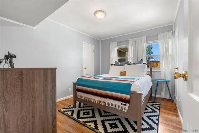 a bedroom with furniture and a window