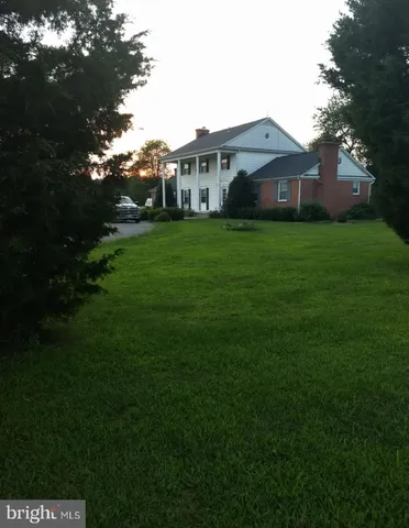 a front view of house with garden