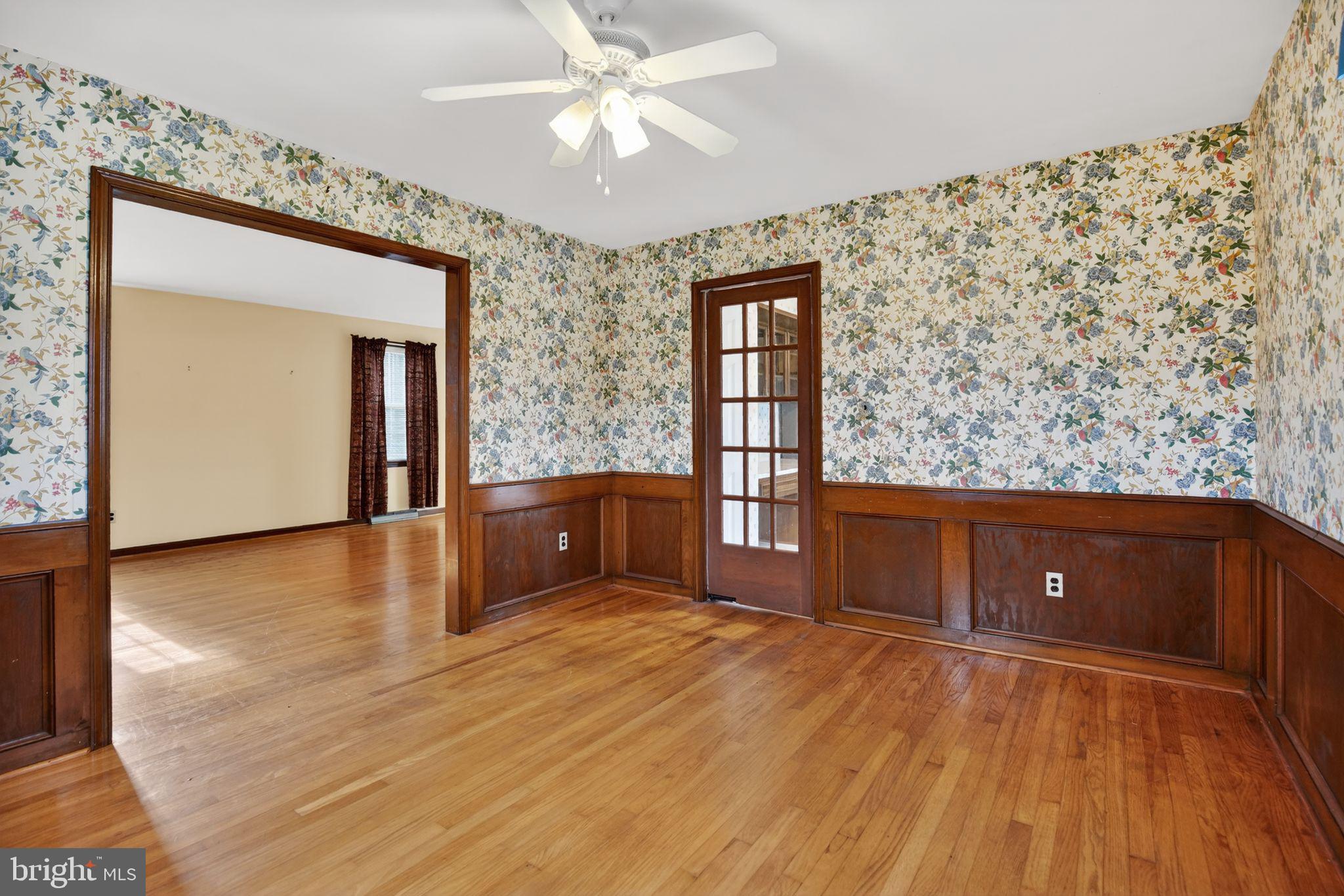 7146 Leonardtown Road Hughesville, MD 20637 - Photo 15 of 34 an empty room with wooden floor and cabinet
