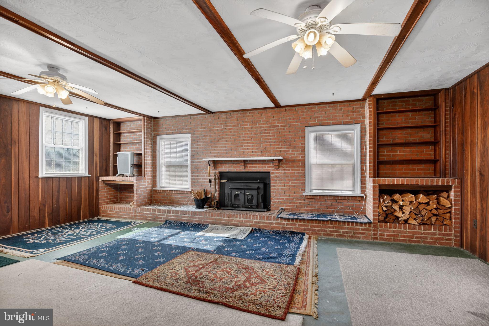 7146 Leonardtown Road Hughesville, MD 20637 - Photo 16 of 34 a living room with furniture and a fireplace