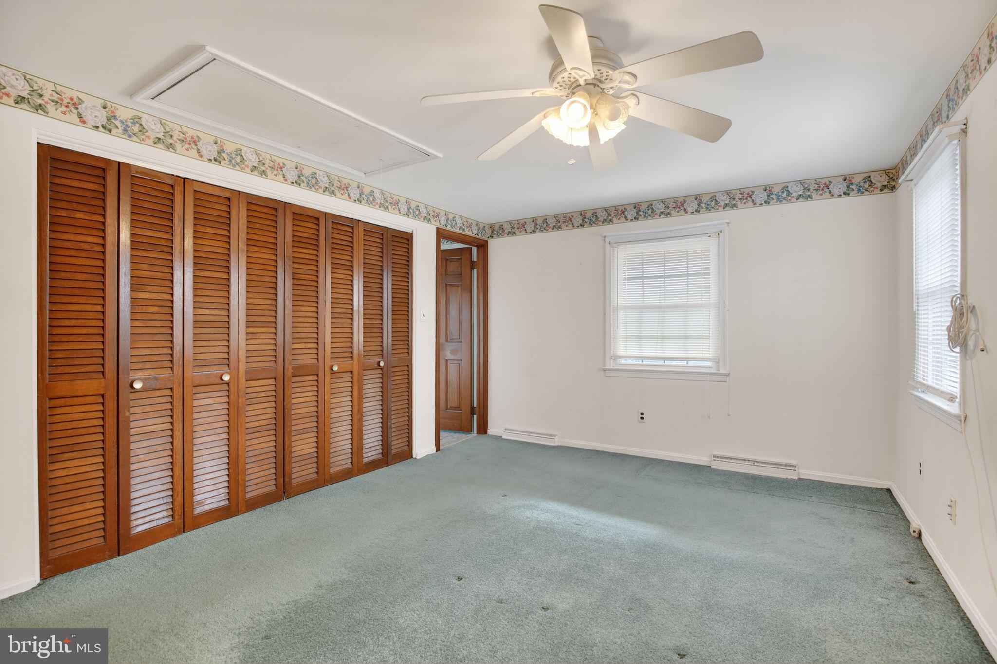 7146 Leonardtown Road Hughesville, MD 20637 - Photo 24 of 34 an empty room with windows and fan