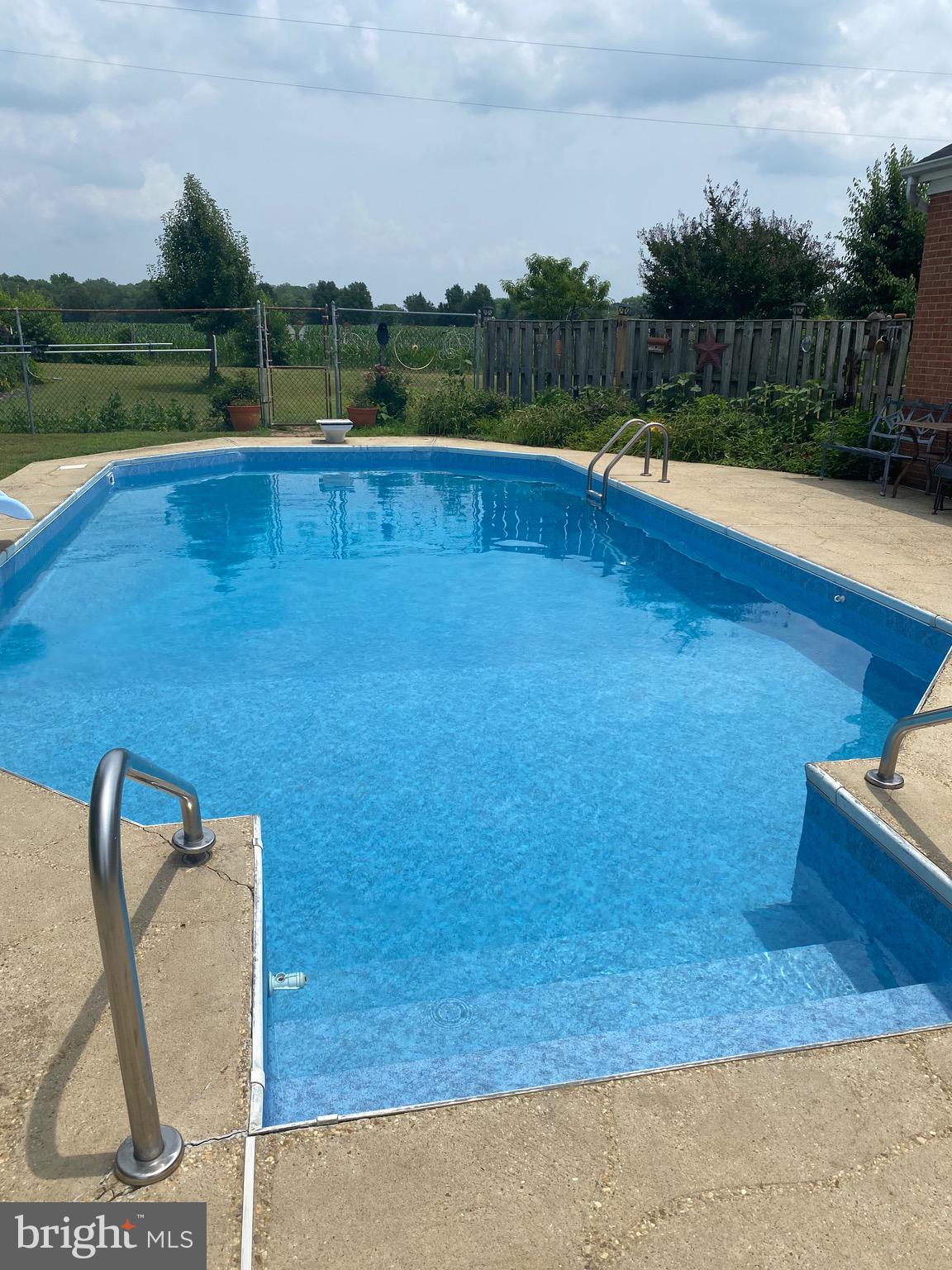 7146 Leonardtown Road Hughesville, MD 20637 - Photo 4 of 34 a view of swimming pool with a yard