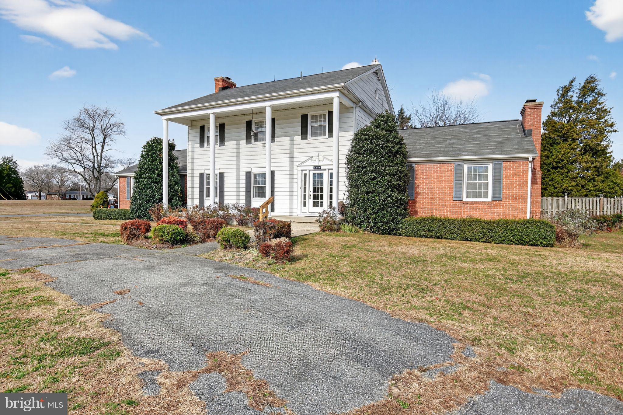 7146 Leonardtown Road Hughesville, MD 20637 - Photo 5 of 34 a front view of a house with garden
