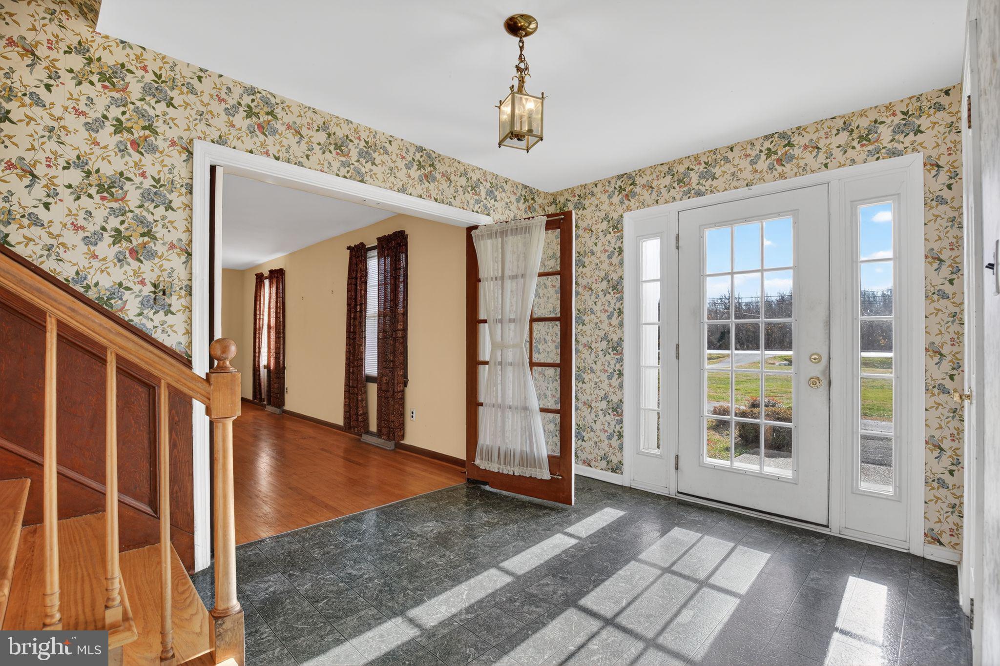 7146 Leonardtown Road Hughesville, MD 20637 - Photo 10 of 34 a view of an entryway with wooden floor and windows