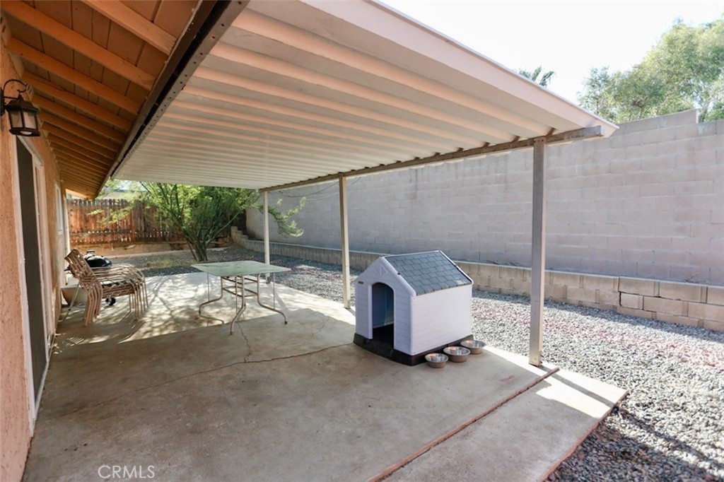 1050 Athena Court Riverside, CA 92507 - Photo 3 of 12 a backyard of a house with table and chairs