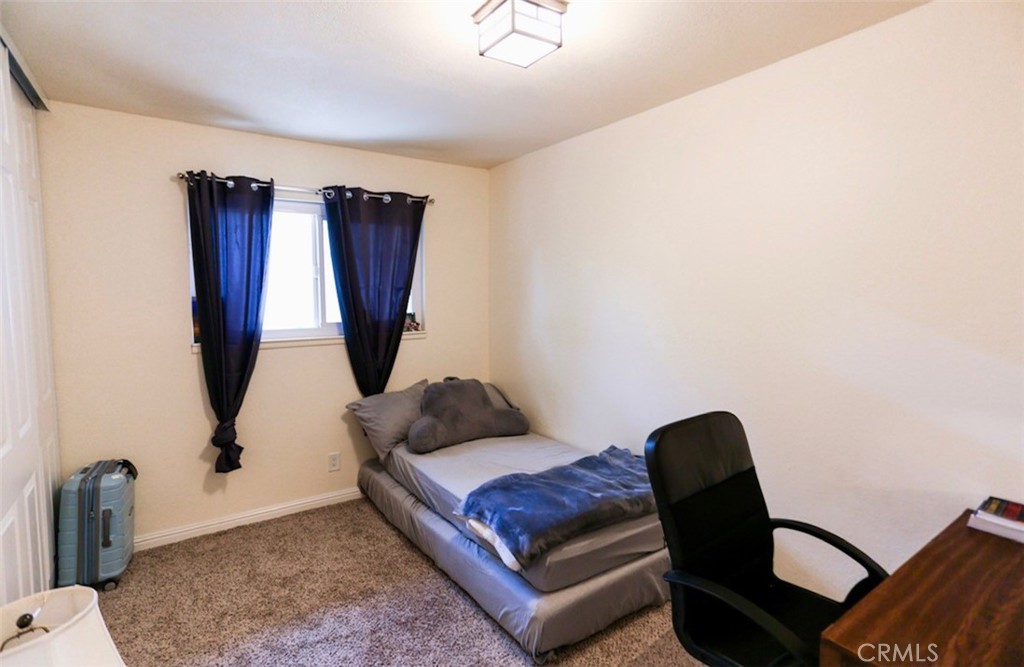 1050 Athena Court Riverside, CA 92507 - Photo 4 of 9 a living room with furniture rug and a window