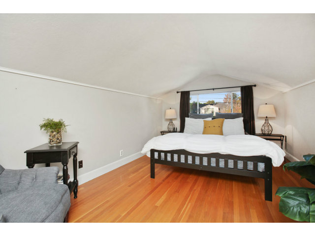 1132 Cambridge Road Burlingame, CA 94010 - Photo 13 of 25 a bedroom with a bed and a table in it