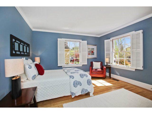 1132 Cambridge Road Burlingame, CA 94010 - Photo 17 of 25 a bedroom with a bed and wooden floor