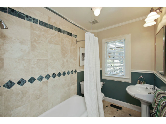 1132 Cambridge Road Burlingame, CA 94010 - Photo 19 of 25 a bathroom with a sink and a mirror