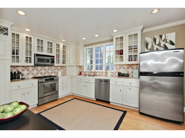 1132 Cambridge Road Burlingame, CA 94010 - Photo 10 of 25 a kitchen with granite countertop cabinets stainless steel appliances and a counter space
