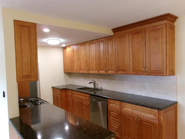 a kitchen with a sink and cabinets