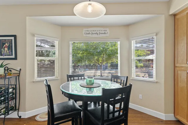 a view of a dining room with furniture window and outside view
