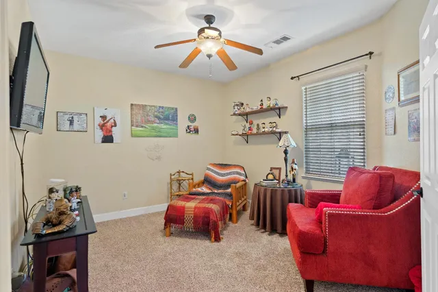 a bedroom with furniture and a window