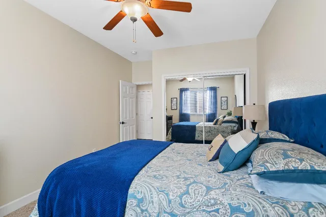 a bed room with a bed and a painting