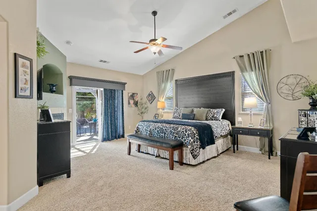 a bedroom with a bed and a fireplace