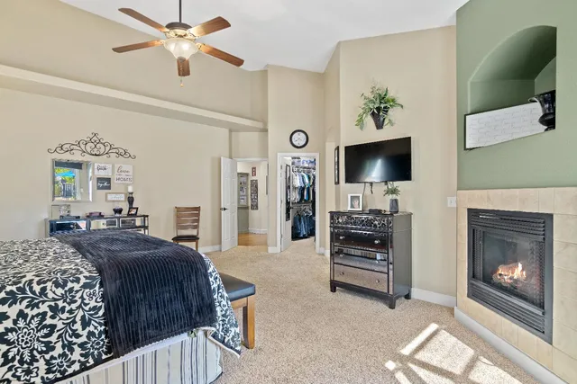 a living room with a fireplace and a window